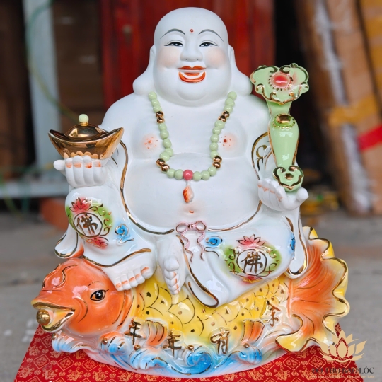 Tượng Di Lặc men sứ ngồi trên cá chép hóa rồng cao 43cm